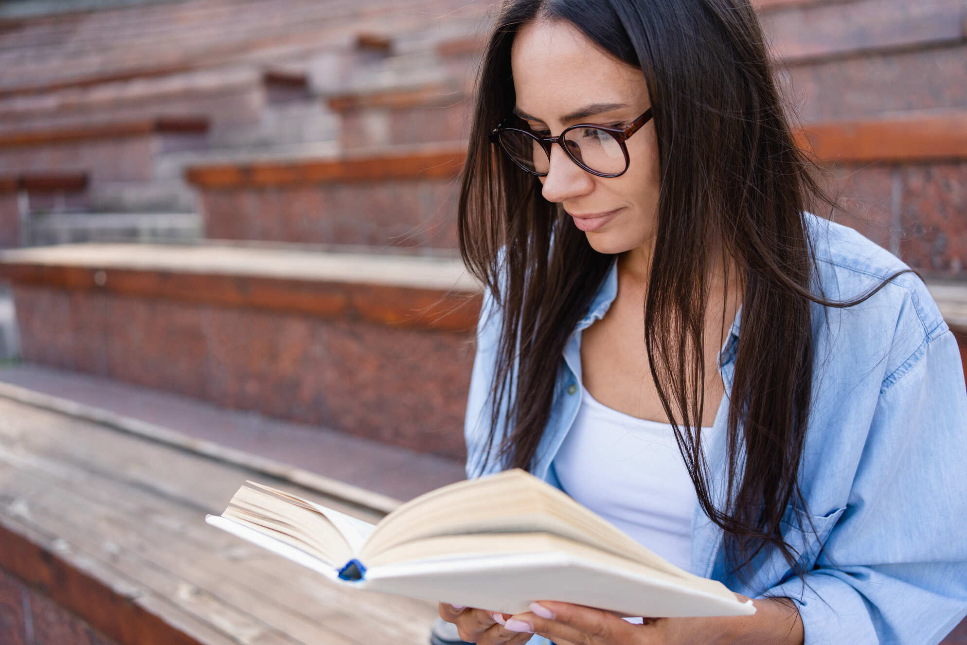 Young woman benefiting from nootropic memory recall while reading